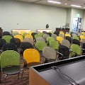 view from podium facing 5 empty rows of chairs